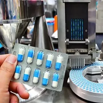 Checking a blister strip at the packing machine